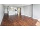 Spacious living room featuring hardwood floors and neutral walls with views to other rooms at 2614 Cove Cay Dr # 301, Clearwater, FL 33760