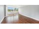 Bright and airy living room with hardwood floors and large windows at 2614 Cove Cay Dr # 301, Clearwater, FL 33760