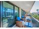 Relax on this spacious balcony with comfortable seating and serene neighborhood views at 2700 Bayshore Blvd # 9209, Dunedin, FL 34698