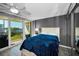 This bedroom provides access to a private balcony with scenic views of the surrounding landscape at 2700 Bayshore Blvd # 9209, Dunedin, FL 34698