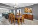 Elegant dining room with a large table, seating for six, and a mirrored wall at 2700 Bayshore Blvd # 9209, Dunedin, FL 34698