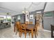 Bright dining room featuring a wooden table, and decor, steps from the living room and kitchen at 2700 Bayshore Blvd # 9209, Dunedin, FL 34698