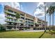 Spacious condo building featuring multiple balconies and covered parking at 2700 Bayshore Blvd # 9209, Dunedin, FL 34698