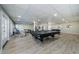 Spacious game room with new floors, a billiard table, and exercise equipment at 2700 Bayshore Blvd # 9209, Dunedin, FL 34698