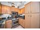 Spacious kitchen featuring stainless steel appliances, light wood cabinets, and granite countertops at 2700 Bayshore Blvd # 9209, Dunedin, FL 34698