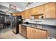 Bright, open kitchen with stainless steel appliances, light cabinets and access to the dining area at 2700 Bayshore Blvd # 9209, Dunedin, FL 34698
