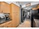 Kitchen area with plenty of storage space, stainless steel appliances, and a stacked washer/dryer unit at 2700 Bayshore Blvd # 9209, Dunedin, FL 34698