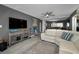 The open living room features a comfortable sectional and sleek gray walls at 2700 Bayshore Blvd # 9209, Dunedin, FL 34698