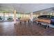 Inviting covered parking area with benches and a table for residents and guests at 2700 Bayshore Blvd # 9209, Dunedin, FL 34698