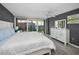 Comfortable main bedroom featuring a ceiling fan, an exterior balcony, and an exterior view at 2700 Bayshore Blvd # 9209, Dunedin, FL 34698