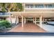 Covered parking area with brick flooring provides shade and protection for vehicles at 2700 Bayshore Blvd # 9209, Dunedin, FL 34698