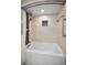 Clean shower and tub area featuring designer tile work, a shower head, and shower curtain at 2700 Bayshore Blvd # 9209, Dunedin, FL 34698
