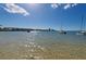 Sparkling waters with sailboats anchored, clear skies, and coastal buildings create a peaceful waterfront view at 2700 Bayshore Blvd # 9209, Dunedin, FL 34698