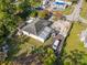Aerial view showcasing the property with a large yard, parking area and surrounding greenery at 2819 N 75 St, Tampa, FL 33619