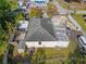Aerial view of the house showing the roof, fenced backyard and surrounding neighborhood at 2819 N 75 St, Tampa, FL 33619