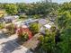 Aerial perspective of a home with mature trees, lush greenery and a driveway at 2819 N 75 St, Tampa, FL 33619