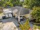 Aerial view of the house showing the front yard, car port, and roof at 2819 N 75 St, Tampa, FL 33619