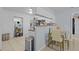 View of the kitchen featuring stainless steel appliances, white cabinetry and tile floors at 2819 N 75 St, Tampa, FL 33619