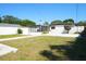 Spacious backyard with a white privacy fence and a screened-in porch at 2936 39Th N Ave, St Petersburg, FL 33714