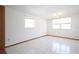 Well-lit bedroom featuring tile flooring, neutral walls, and bright windows at 2936 39Th N Ave, St Petersburg, FL 33714