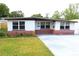 Charming single-story home featuring a well-maintained lawn and inviting curb appeal at 2936 39Th N Ave, St Petersburg, FL 33714