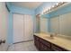 Bathroom featuring a vanity sink with a cabinet, tiled floors and an enclosed shower at 30 Turner St # 502, Clearwater, FL 33756