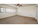 Bedroom featuring a ceiling fan, neutral carpet, and natural light from the window at 30 Turner St # 502, Clearwater, FL 33756
