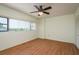 Bedroom boasting hardwood floors, a ceiling fan, and large windows for ample natural light at 30 Turner St # 502, Clearwater, FL 33756