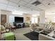 Comfortable clubhouse offers a relaxing space with couches, chairs, and a television at 30 Turner St # 502, Clearwater, FL 33756