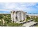Elegant high-rise condo with multiple balconies, covered parking, and waterfront views on a sunny day at 30 Turner St # 502, Clearwater, FL 33756