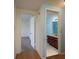 Hallway view leading to the bedroom and bathroom with tiled floors and blue walls at 30 Turner St # 502, Clearwater, FL 33756