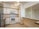 Kitchen featuring tile countertops, white cabinets, and stainless steel appliances at 30 Turner St # 502, Clearwater, FL 33756