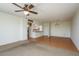 Open-concept living area with eat-in kitchen, laminate flooring, and a ceiling fan at 30 Turner St # 502, Clearwater, FL 33756