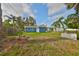 Spacious backyard with a grassy area and the building in the background at 3241 Williamsburg St, Sarasota, FL 34231