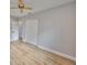Bright bedroom features new flooring, neutral paint and ceiling fan at 3241 Williamsburg St, Sarasota, FL 34231