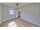 Bedroom featuring new flooring, fresh paint, a window and a ceiling fan at 3241 Williamsburg St, Sarasota, FL 34231