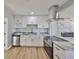Kitchen with granite countertops, stainless steel appliances, and white cabinets at 3241 Williamsburg St, Sarasota, FL 34231