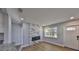 Living room featuring fireplace and wood-look flooring, providing a cozy atmosphere at 3241 Williamsburg St, Sarasota, FL 34231