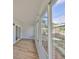 Enclosed lanai features new flooring, neutral paint, and lots of windows at 3241 Williamsburg St, Sarasota, FL 34231