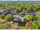 An aerial view of the home in a lush neighborhood showing backyard pool and landscaping at 3313 W Mullen Ave, Tampa, FL 33609