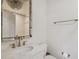 Bathroom vanity with a decorative mirror and bronze fixtures at 3313 W Mullen Ave, Tampa, FL 33609