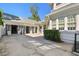 White-painted garage with carriage doors and a covered walkway to the home at 3313 W Mullen Ave, Tampa, FL 33609