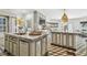 Spacious kitchen features marble countertops, stainless steel appliances, and unique flooring, perfect for cooking and entertaining guests at 3313 W Mullen Ave, Tampa, FL 33609