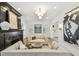 Bright living room featuring a fireplace, modern sofas, and ample natural light for a warm ambiance at 3313 W Mullen Ave, Tampa, FL 33609