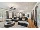 Expansive living room with a plush sofa, unique lighting, stylish decor, and ample space for entertaining guests and relaxing at home at 3313 W Mullen Ave, Tampa, FL 33609