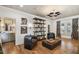 Elegant living room features hardwood floors, modern lighting, and stylish decor, perfect for relaxing and entertaining guests at 3313 W Mullen Ave, Tampa, FL 33609