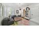 Inviting living room with a floral rug, comfortable seating, and bright, natural light at 3313 W Mullen Ave, Tampa, FL 33609
