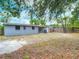 View of the backyard and exterior with access from a sliding glass door at 3407 N 48Th St, Tampa, FL 33605