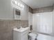 Bathroom featuring new fixtures and updated tile at 3407 N 48Th St, Tampa, FL 33605