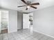 Bedroom features tile flooring, a ceiling fan, and a closet at 3407 N 48Th St, Tampa, FL 33605